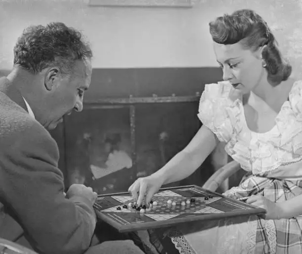 Olivia de Havilland playing Chinese checkers with her husband, - 1948 Old Photo