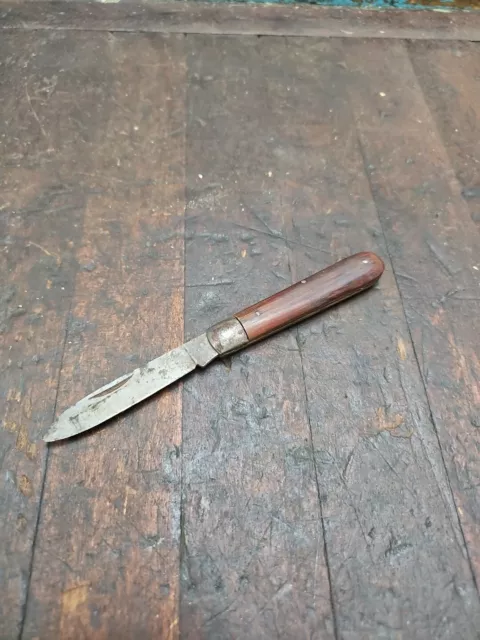 K983- Antique wood handle folding pocket knife marked Germany w/ 2 birds