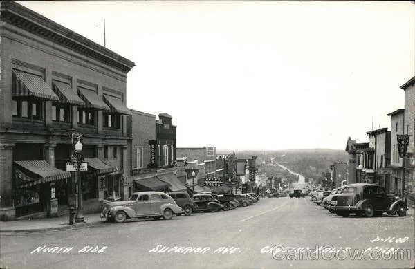 1955 RPPC Crystal Falls,MI North Side of Superior Avenue Iron County Michigan