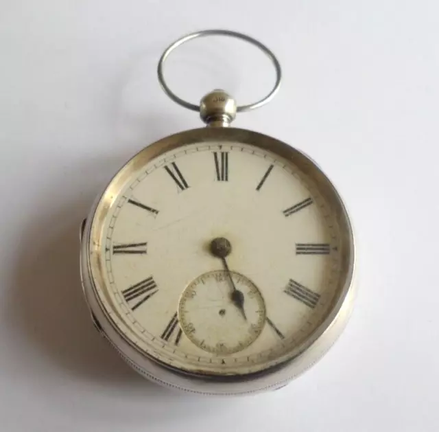 Antique Victorian large, heavy silver pocket watch, key wind, requires repair.