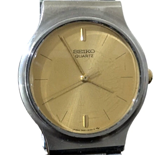 Montre Femme Vintage Seiko Quartz - Cadran Or, Boîtier Acier, Bracelet Extensible, état Très Bon