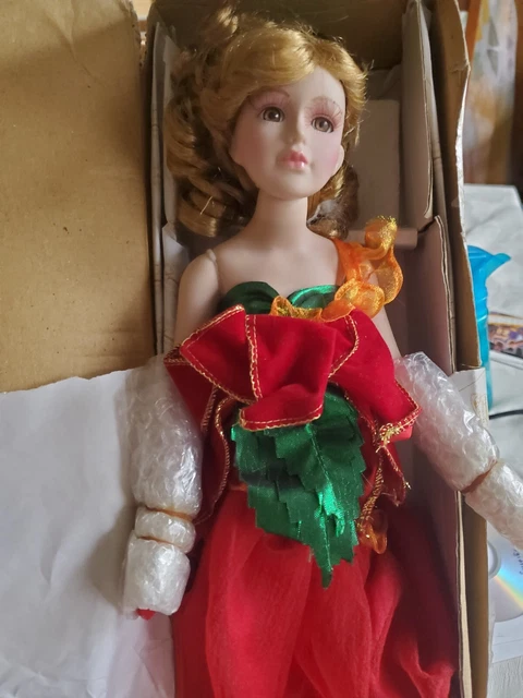 heritage signature collection porcelain Poinsetta Doll