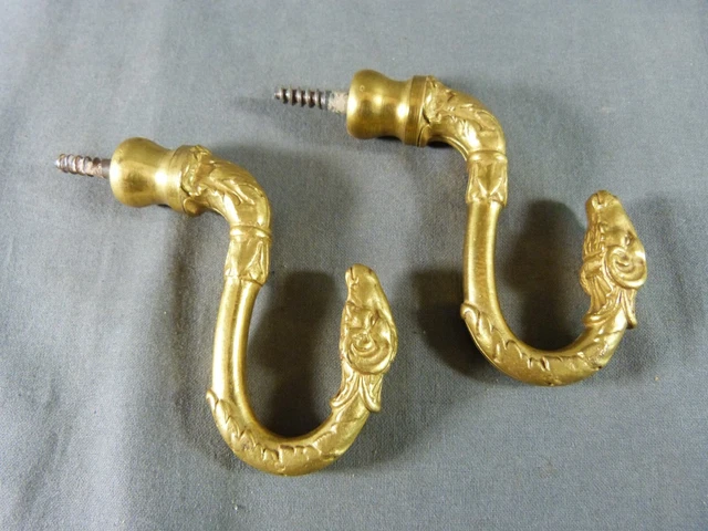 Pair of French ormolu curtain tiebacks with Aries head, Empire style