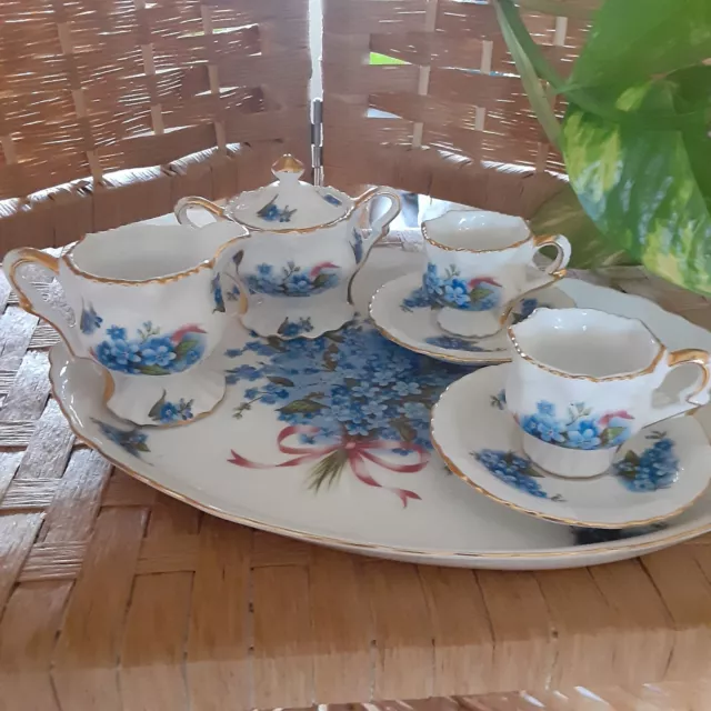 Minature tea set violet pattern. Creamer, sugar bowl, 2 cups and saucers with tr