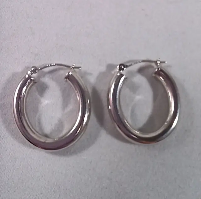 JCM Design Jewelry 14KT WG Oval Hoop Earrings 1"