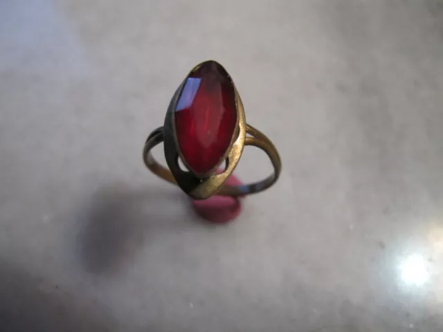 Antique Bronze Late Georgian  Ring With Red Glass Stone .