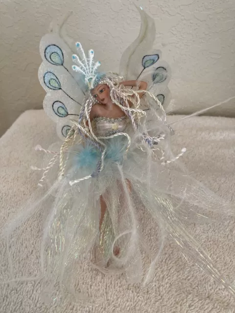 Porcelin Fairy Figurine.  Elegant peacock design