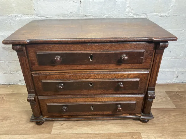 A Late 19th Century Carved Oak Miniature Chest Of Drawers