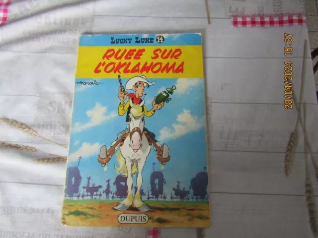 LUCKY LUKE  tome 14,,, BD avec  couverture souple ,,dos jaune ..EO a vérifier