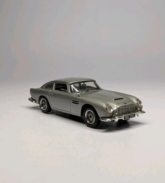 Photo Of A Silver Die Cast Model Of The Aston Martin DB5 Used In The Sean Connery James Bond 007 Movie Goldfinger In 1964 With The Villain Exiting Image402023824