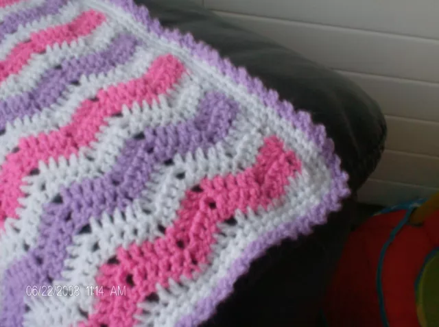 hand crochet Baby Shawl in pink. Lilac and white Zig Zag Design