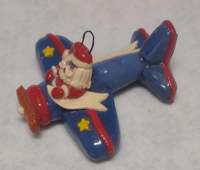 VINTAGE CALLIOPE DESIGN Santa Claus in Blue Airplane Christmas Ornament