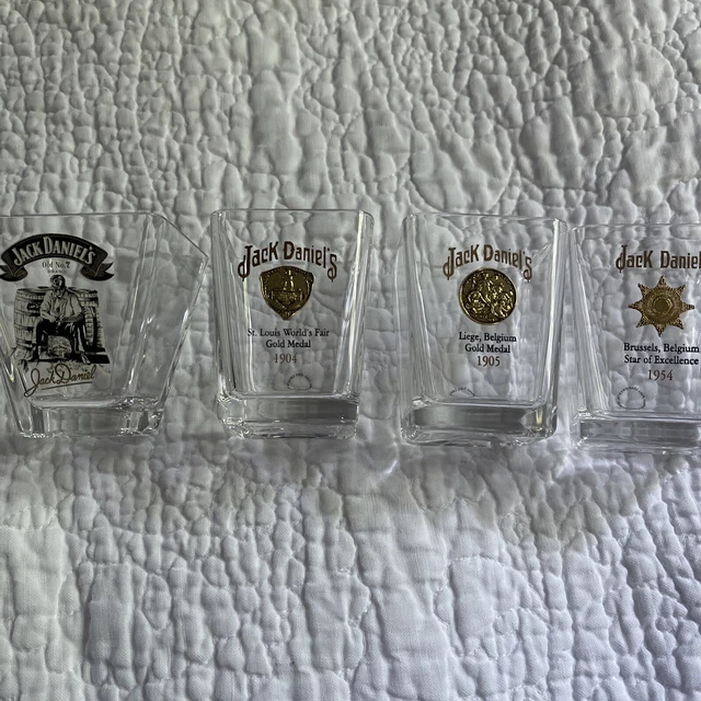 Jack Daniels Gold Metal Shot Glass Set of 3 Plus One Whittling Old No 7. Jack Daniels Gold Metal Shot Glass Set of 3 Plus One Whittling Old No 7.