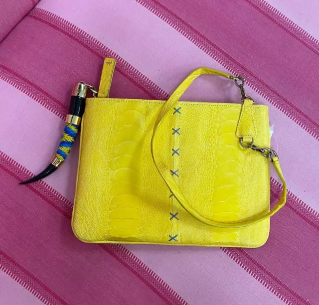 Okapi Aja Ostrich Yellow Wristlet and Zen Zulu Springbok Charm, MSRP $680 2