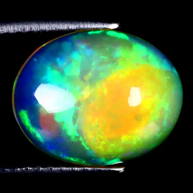 3.38 ct Oval Cabochon (13 x 10 mm) Ethiopian 360 Degree Flashing Rainbow Opal