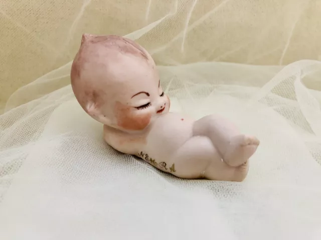 VINTAGE Cute Kewpie Laying on Floor Doll Figurine Porcelain Bisque