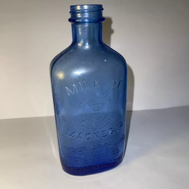 Vintage Embossed Blue Glass Milk Of Magnesia Bottle