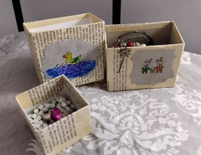 A lot of vintage scrap for creativity, with handmade boxes and handmade drawing