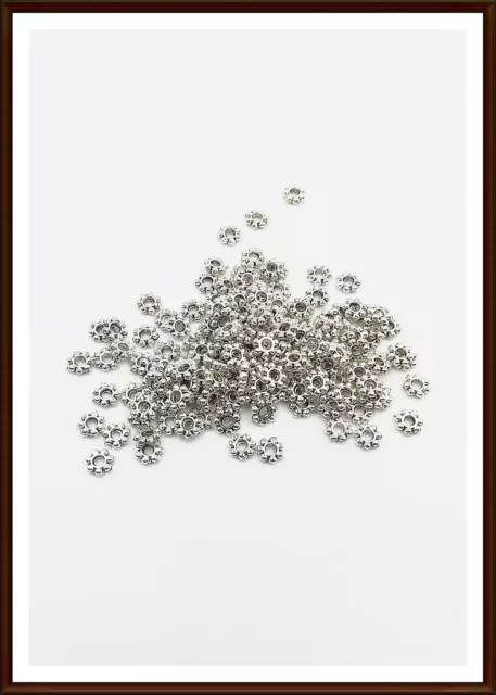 100 Stern Blume Zwischenperle 4x1,3 mm  Spacer Antik silber Metallperlen Engel