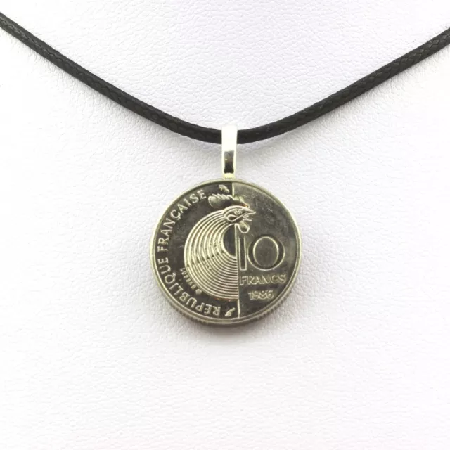 Collier pièce de monnaie France 10 francs Robert Schuman. Cordon noir.