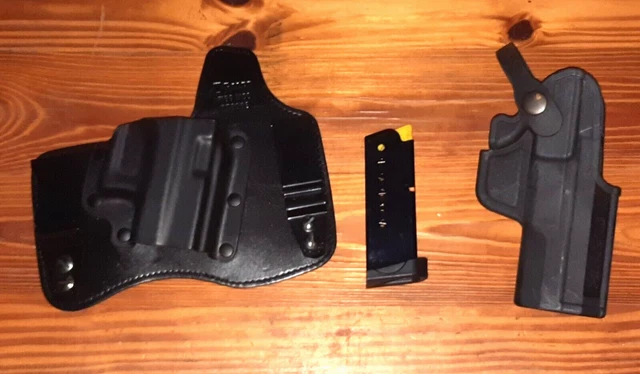 Two Holsters Of Some Sort And A Clip, Likely A 25 Or 32. Taken In On A Trade.