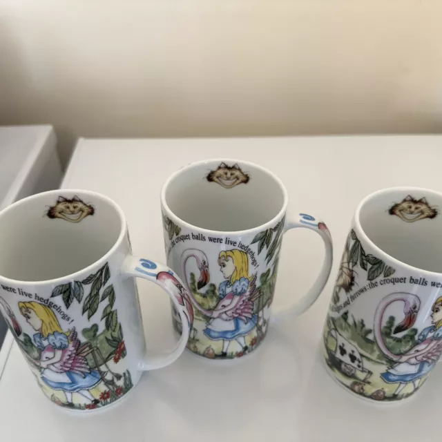 A Rare 4 X Alice In Wonderland Tall Mugs By Paul Cardew