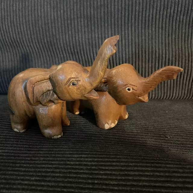 Small hand carved wooden Indian elephants pair