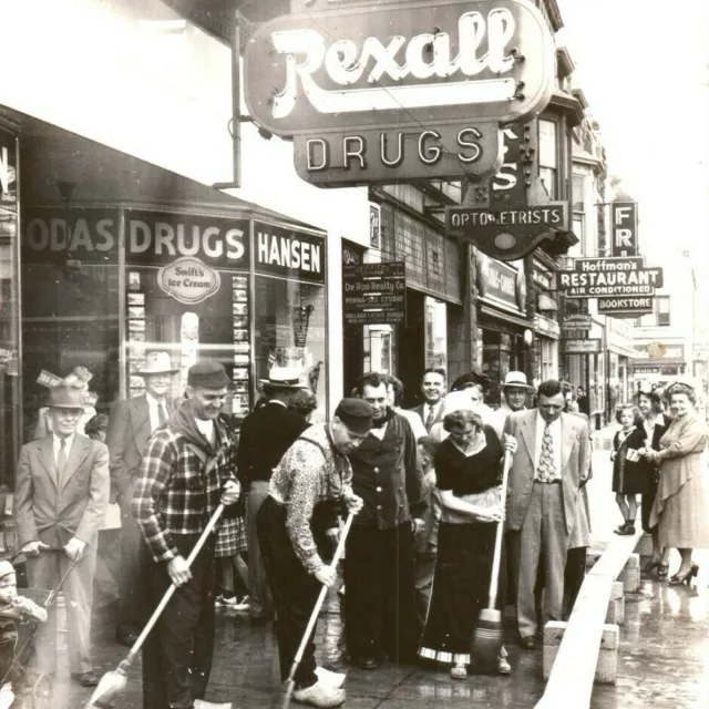 c.1940 Tulip Festival Street Scrubbing Holland MI RPPC Street View Rexall Loaded
