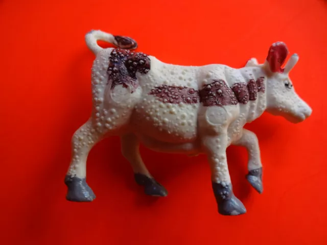 Decorazione natalizia statua presepe ""Mucca che corre - bianco - viola macchiato