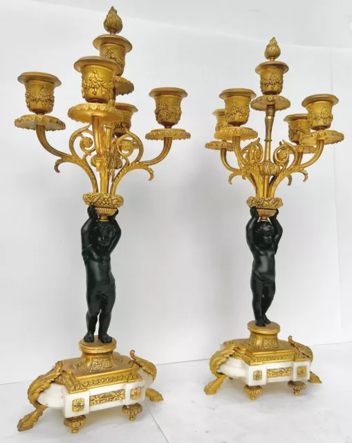 Pair of French Gilt Bronze Candlesticks, 19th century. 