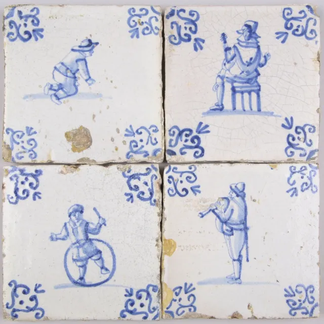 Nice set of 4 Dutch Delft Blue tiles, childplay and musicans, 17th. century.