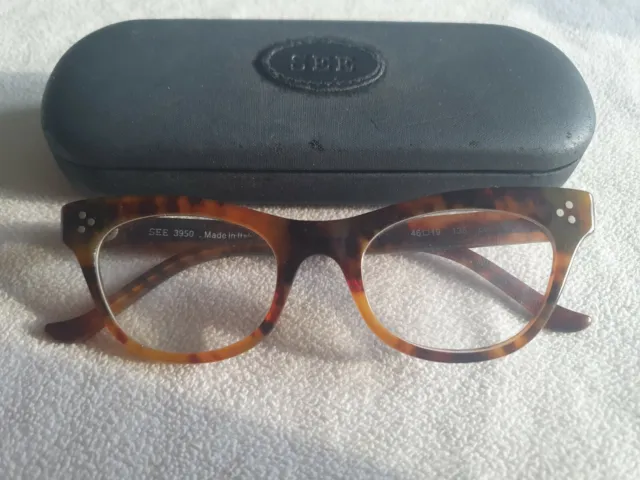 See brown tortoiseshell cat's eye glasses frames. 3950. With case.
