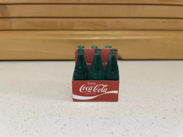 Six Miniature 1 5/8 Inch Green Plastic Coca-Cola Bottles in Carton