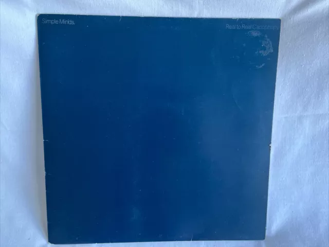 SIMPLE MINDS - REAL TO REAL CACOPHONY VINYL LP RECORD in GOOD+ CONDITION.