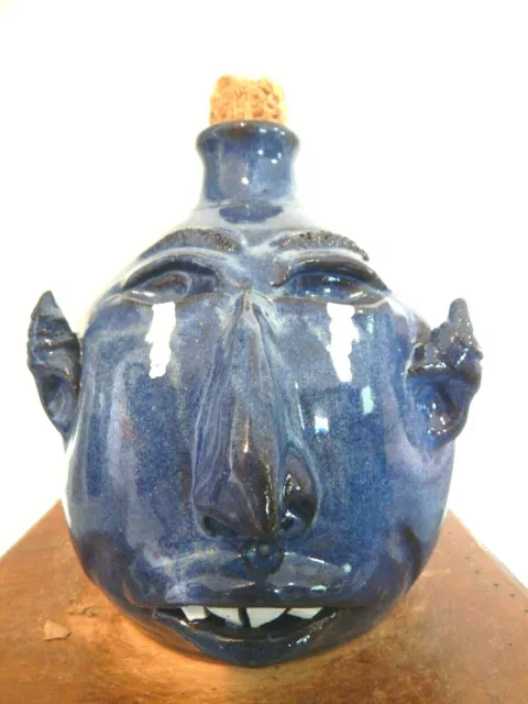 wayne hewell  face jug, pottery, folk art  9''x 6''