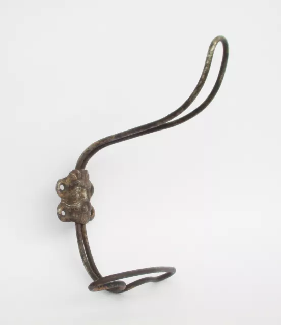 Antique ornate with bearded man at center double clothes iron coat hook hanger