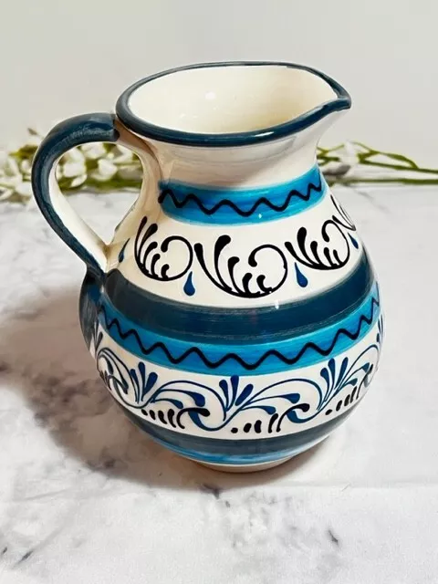 https://www.picclickimg.com/05wAAOSw0rNkuyft/Blue-and-White-Hand-Painted-Water-Pitcher-Made.webp