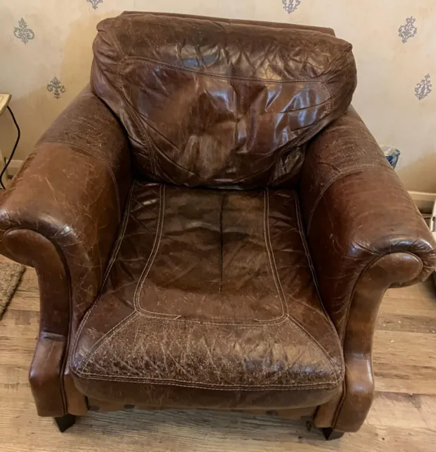 Vintage distressed brown leather club armchair