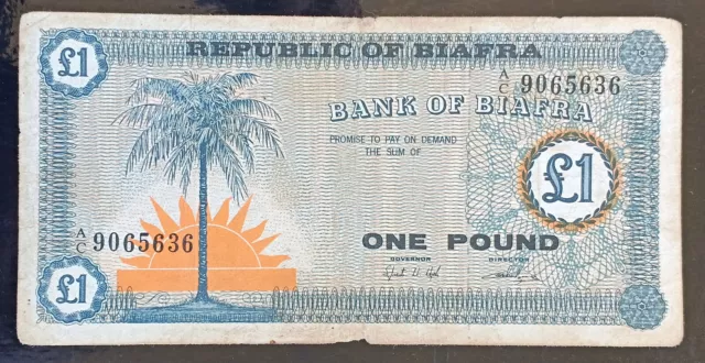 AC12- Biafra 1967 1 pound note P-2 Palm tree & rising sun / Back: Coat of Arms