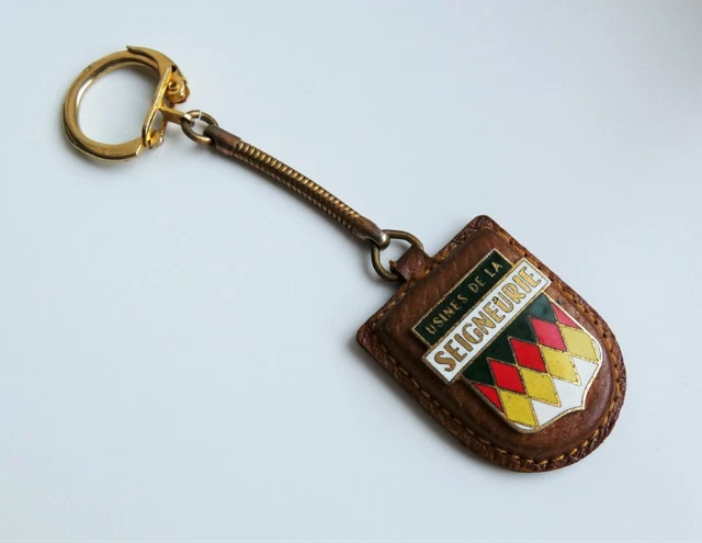 Ancien porte clé cuir métal émail Peinture Usines de la Seigneurie Ann. 60