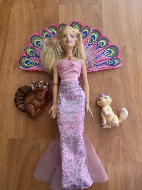 Barbie as The Island Princess Doll with original pets and tail, but not dress