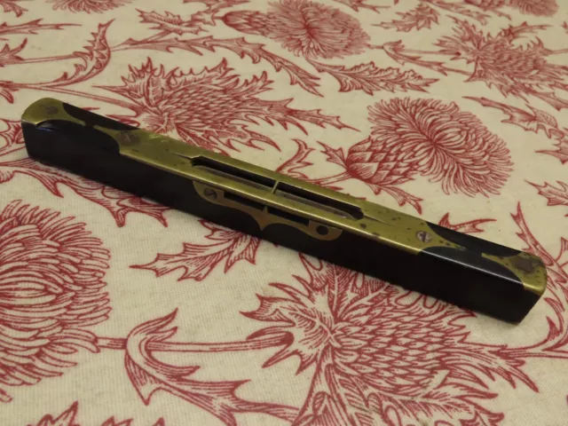 Ornate ebony & brass small spirit level