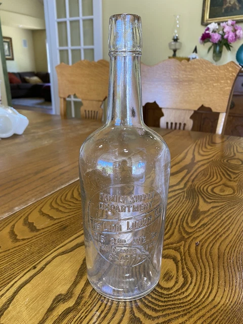 Antique Whiskey Bottle “￼ The Lion, Liquor Company, Seattle, Washington”￼