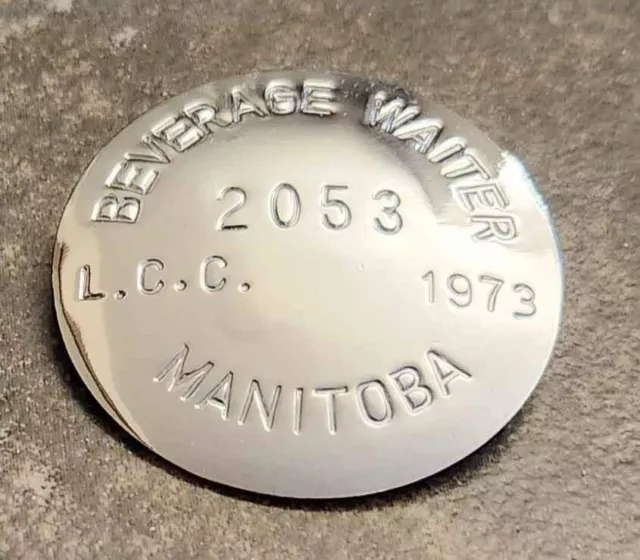 Nice vintage 1973 Manitoba Beverage Waiter metal badge