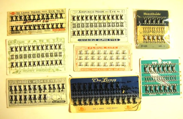 Eight sets of antique and vintage hooke & eyes on original cards