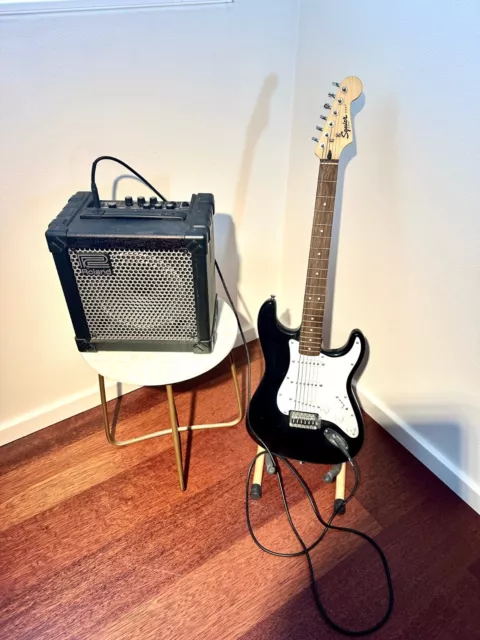 Fender Squier Strat and Roland  Cube-15 Amp + Guitar stand, bag and AUX Cable