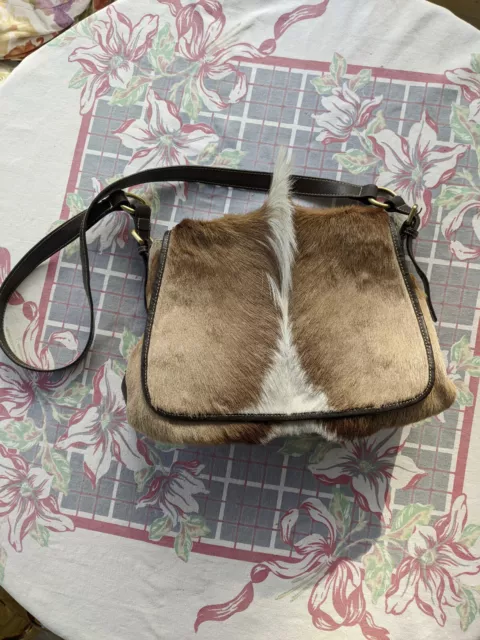 diane gail gently used spring bok purse with fur