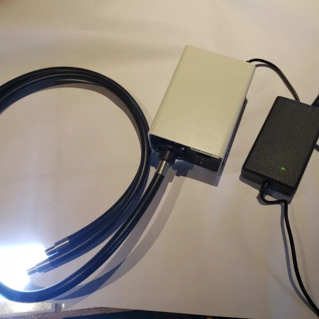 Fiber optic illuminator with light guide