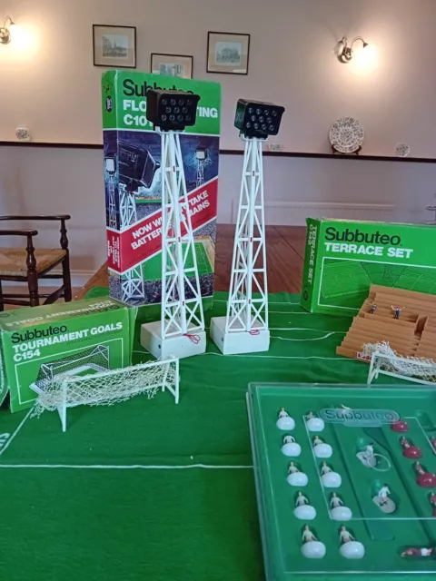 subuteo job lot pitch, players, floodlights, stand, goals, tv tower,balls