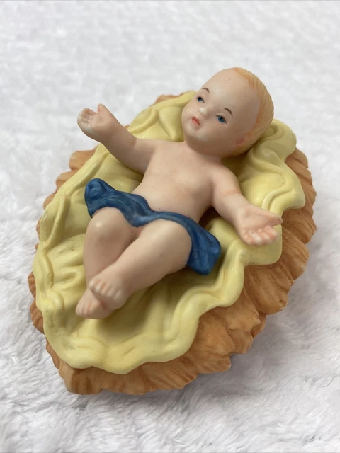 Figurine Of Baby Jesus Christ In A Christian Nativity Scene Stock Photo